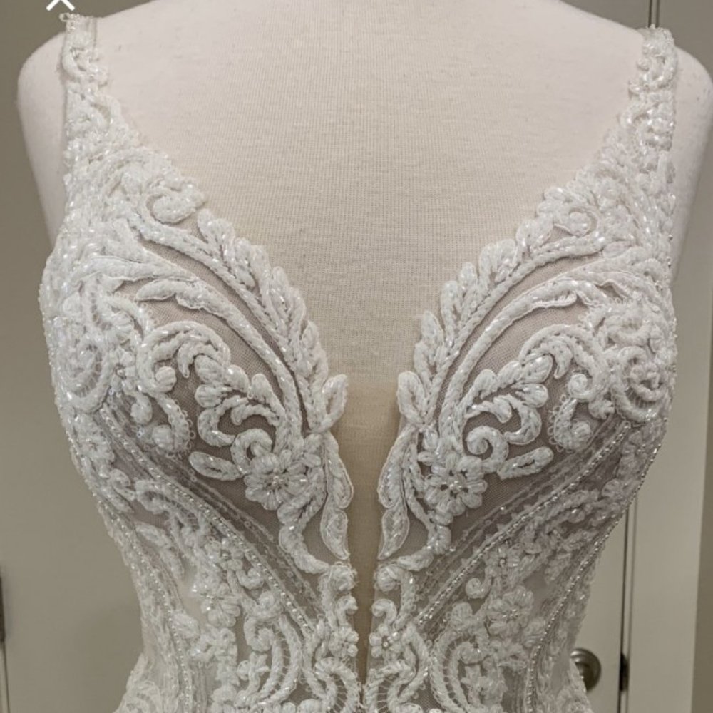 Embroidered wedding gown with beading